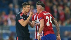 MADRID, SPAIN - APRIL 27:  Jose Gimenez of Atletico Madrid and Robert Lewandowski of Bayern Munich argue as Stefan Savic of Atletico Madrid intervenes during the UEFA Champions League semi final first leg match between Club Atletico de Madrid and FC Bayern Muenchen at Vincente Calderon on April 27, 2016 in Madrid, Spain.  (Photo by Alexander Hassenstein/Bongarts/Getty Images)