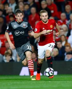 Football Soccer Britain - Manchester United v Southampton - Premier League - Old Trafford - 19/8/16 Manchester United's Luke Shaw in action with Southampton's Pierre-Emile Hojbjerg Action Images via Reuters / Jason Cairnduff Livepic EDITORIAL USE ONLY. No use with unauthorized audio, video, data, fixture lists, club/league logos or "live" services. Online in-match use limited to 45 images, no video emulation. No use in betting, games or single club/league/player publications. Please contact your account representative for further details.