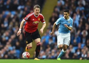 MANCHESTER, ENGLAND - MARCH 20: Bastian Schweinsteiger of Manchester United is chased by Jesus Navas of Manchester City during the Barclays Premier League match between Manchester City and Manchester United at Etihad Stadium on March 20, 2016 in Manchester, United Kingdom. (Photo by Laurence Griffiths/Getty Images)
