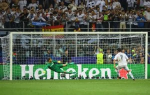 MILAN, ITALY - MAY 28: Cristiano Ronaldo of Real Madrid scores the winning penalty during the UEFA Champions League Final match between Real Madrid and Club Atletico de Madrid at Stadio Giuseppe Meazza on May 28, 2016 in Milan, Italy. (Photo by Shaun Botterill/Getty Images)