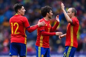 SALZBURG, AUSTRIA - JUNE 01: David Silva (C) of Spain celebrates with his teammates Hector Bellerin and Andres Iniesta after scoring the opening goal during an international friendly match between Spain and Korea at the Red Bull Arena stadium on June 1, 2016 in Salzburg, Austria. (Photo by David Ramos/Getty Images)