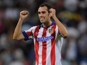 MADRID, SPAIN - SEPTEMBER 13:  Diego Godin of Atletico de Madrid celebrates after Atletico beat Real Madrid 2-1 in the La Liga match between Real Madrid and Atletico de Madrid at Estadio Santiago Bernabeu on September 13, 2014 in Madrid, Spain.  (Photo by Denis Doyle/Getty Images)